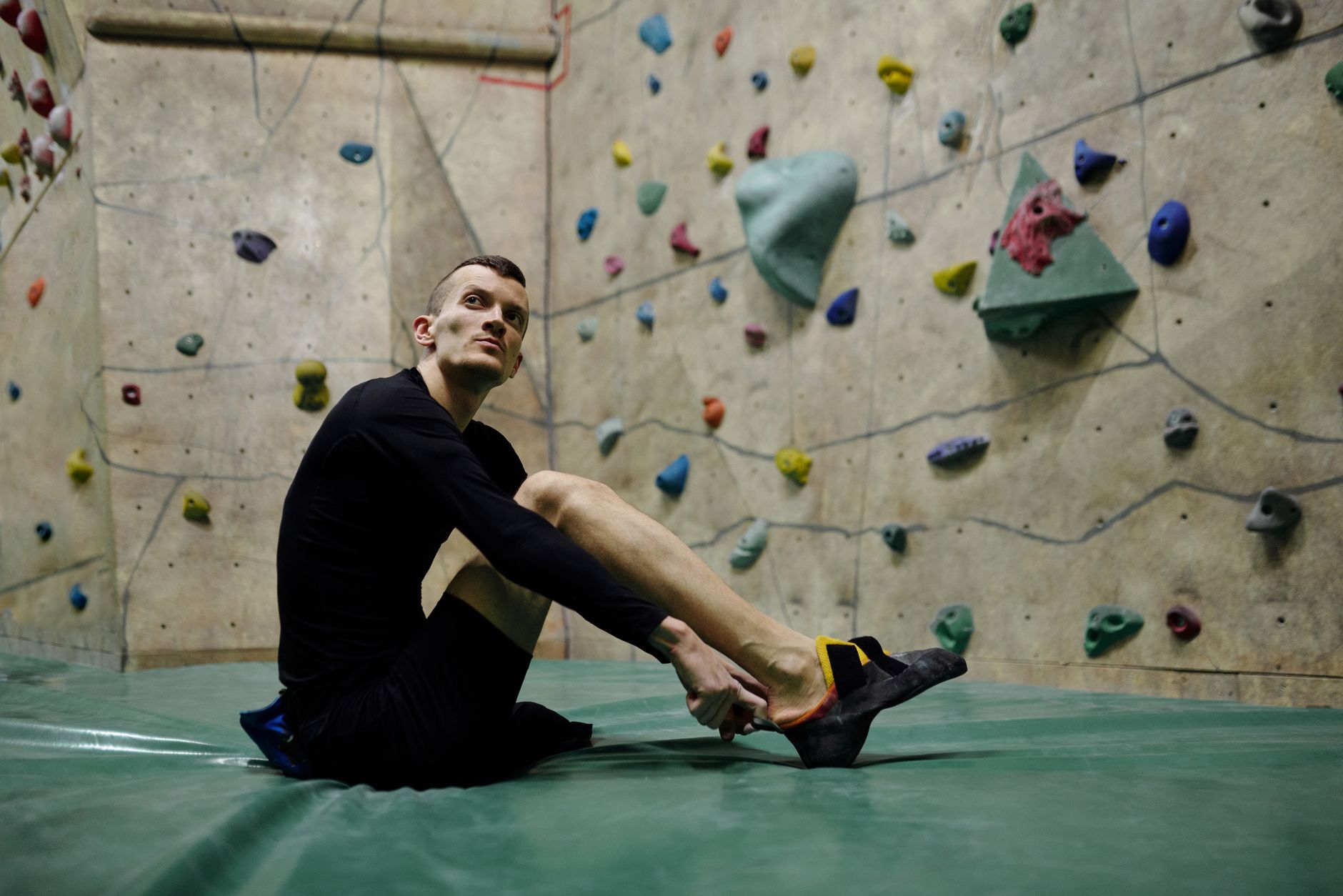 Cover illustration for a rock climbing training plan, with a calendar, hangboard, stopwatch, and climbing holds